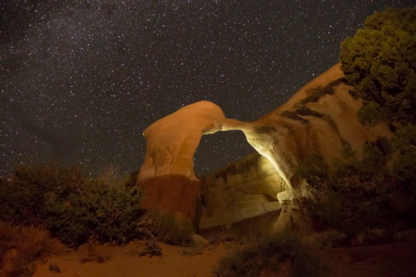 Night view of a stone arch at Devils Garden in Arches National Park, Utah.